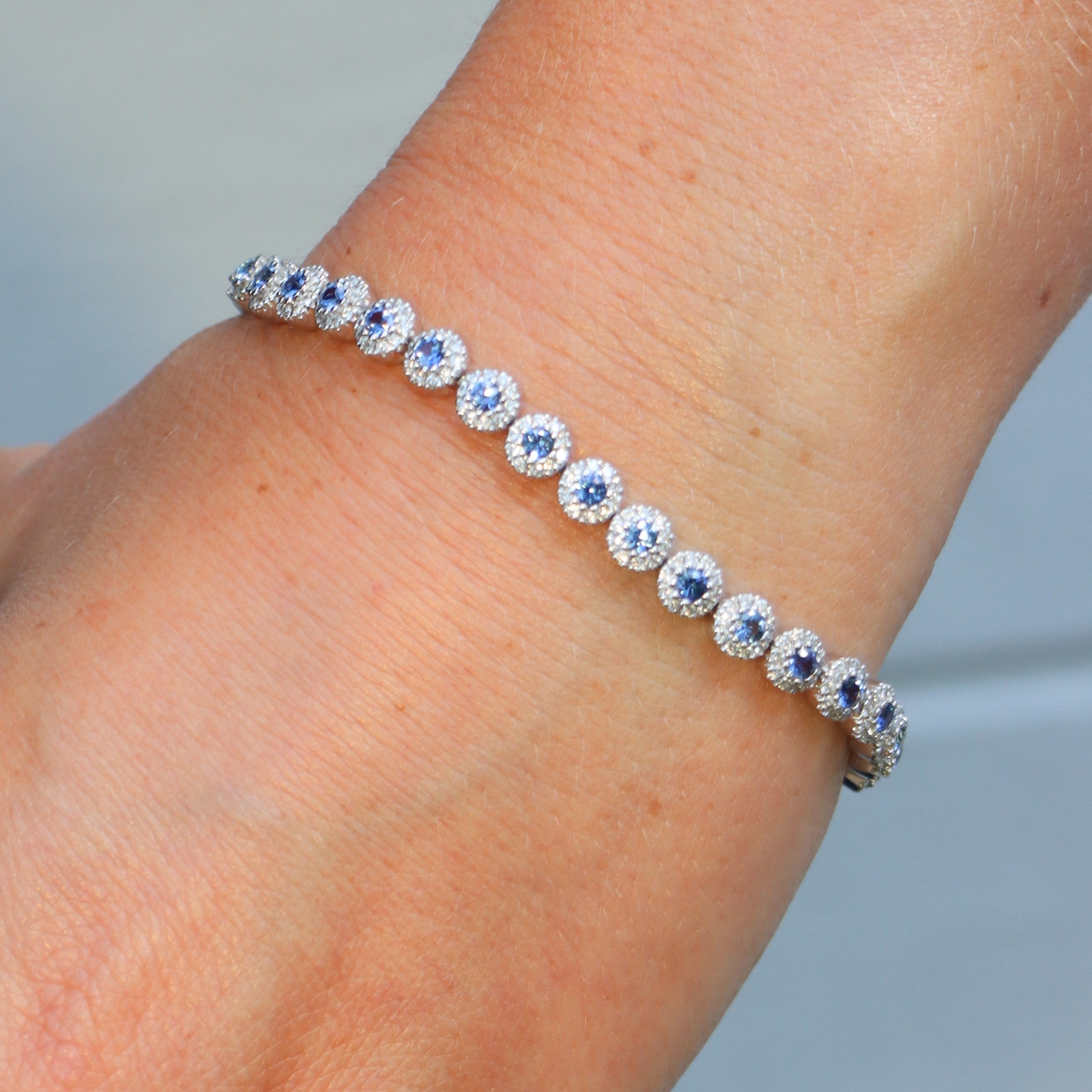 14k White Gold Blue Sapphire and Diamond Halo Tennis Bracelet - Charles Koll Jewelers